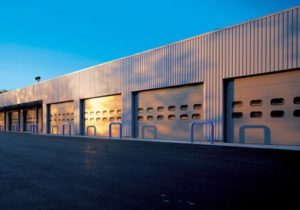 Commercial garage doors on an industrial warehouse